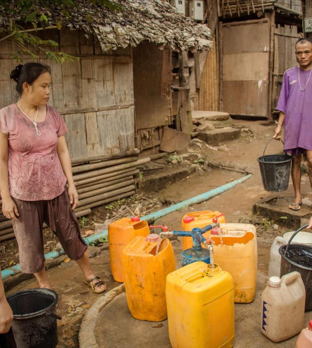 Photo of people fetching water