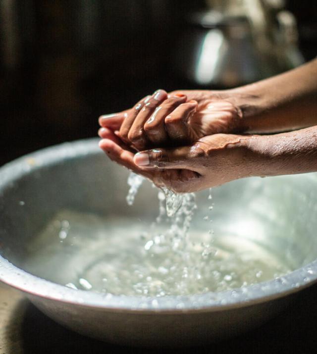 photo of woman washing her hands