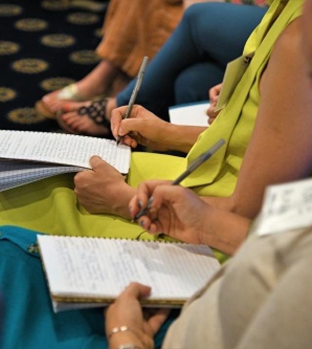 photo of people taking notes