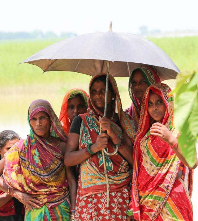 Group of women under an umbrella