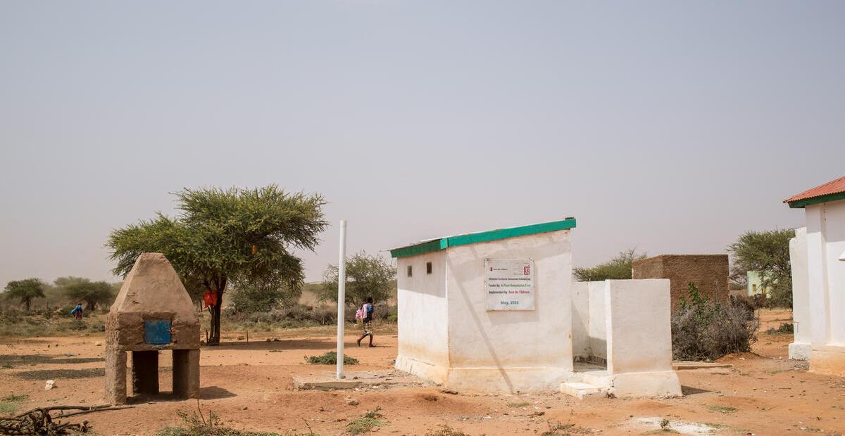 A mobile health clinic in Somaliland featuring a white with green trim latrine.