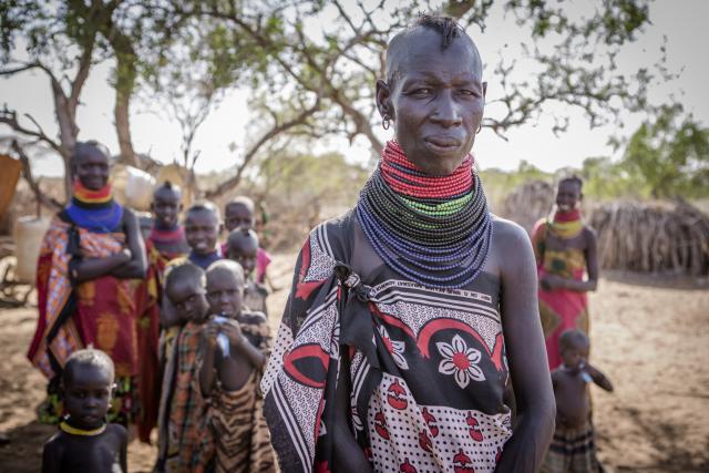 Group of women and children standing in a village in Kenya